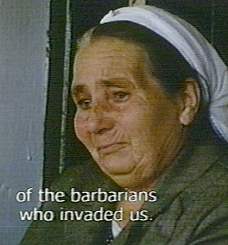 Voice-over of a Greek-Cypriot complaining of the Turkish "barbarians," while her pictured friend weeps