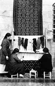 Three Armenian girls and their rug