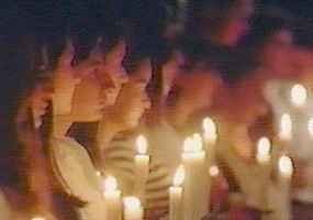 Armenians with lit candles